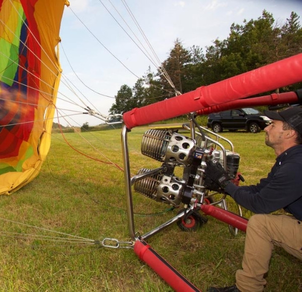 pilot inflates the balloon