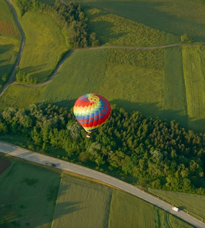 Multicolored hot air balloon seen from above