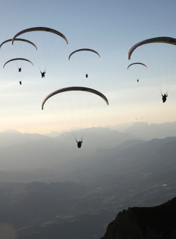 group paragliding flight in the mountains