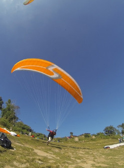 first paragliding student take-off