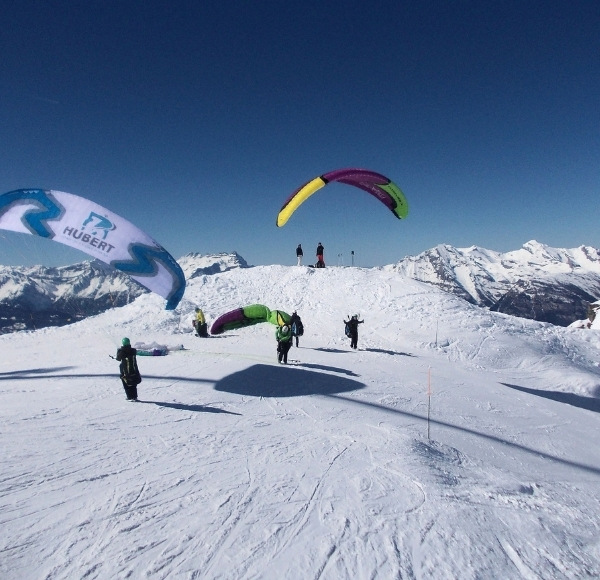 Snow paragliding flight